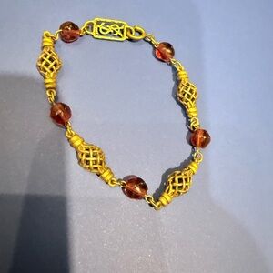 Yves Saint Laurent Gold and Arty Clear Ruby Cabochon Interlinked Bracelet.
